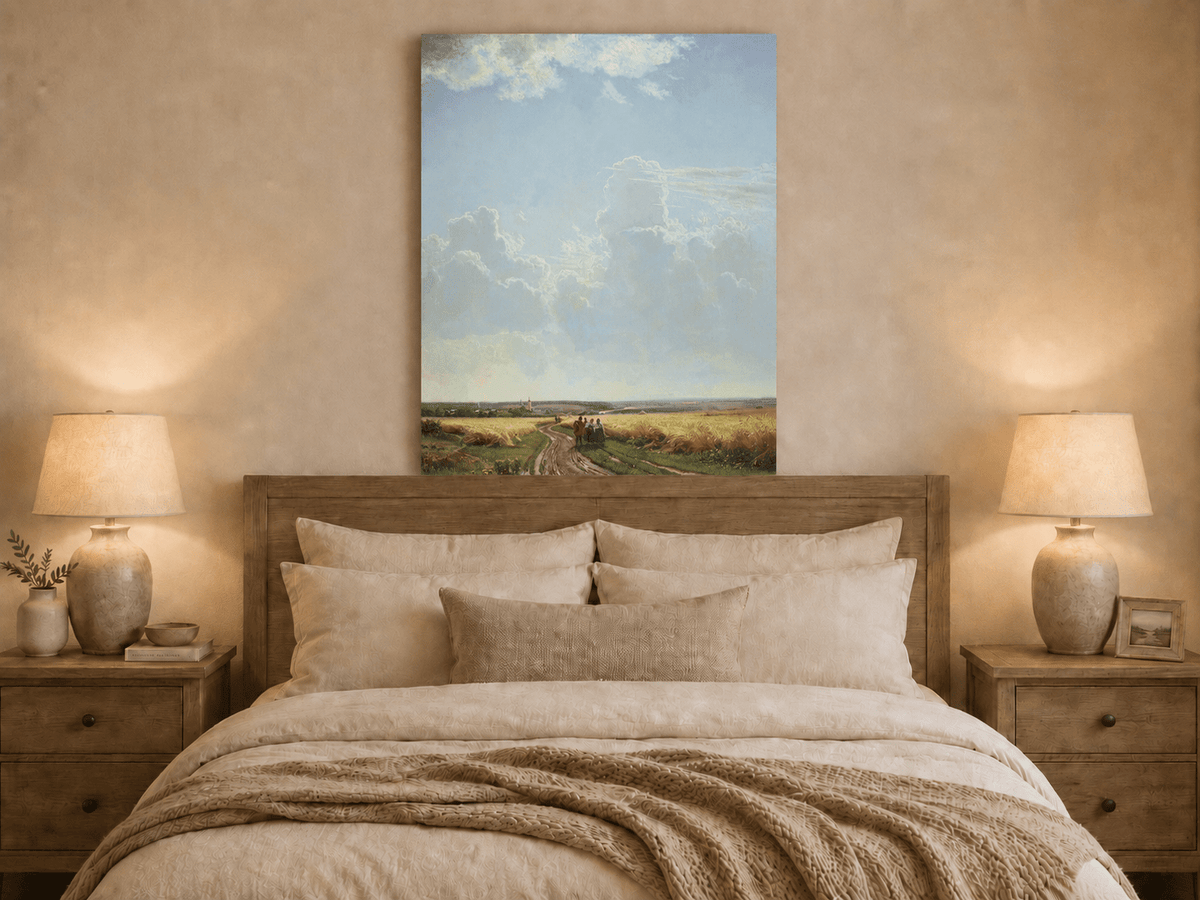 Unframed hand-painted countryside oil painting with a road through wheat fields beneath broad clouds displayed above a wooden bed in a neutral bedroom.