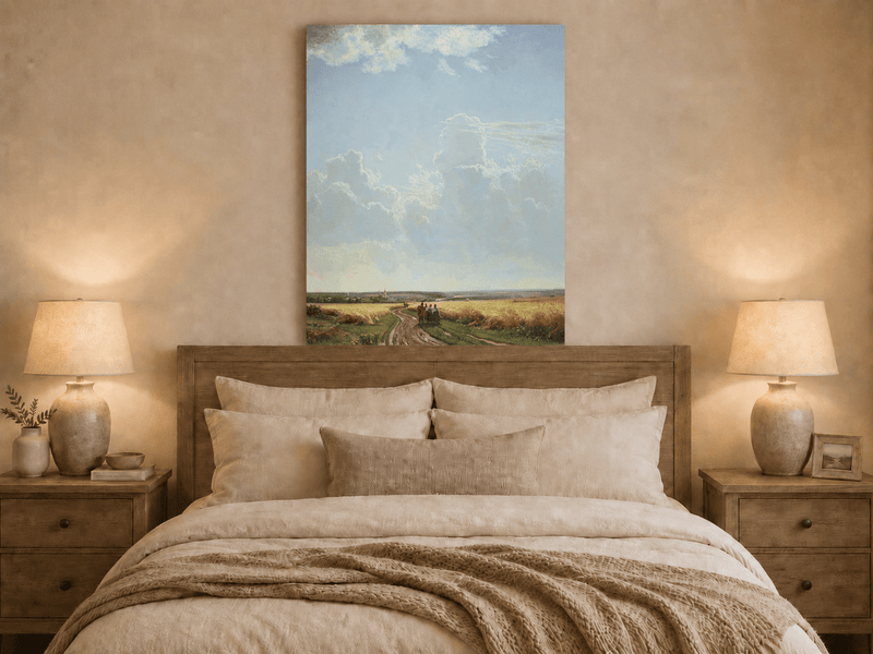 Unframed hand-painted countryside oil painting with a road through wheat fields beneath broad clouds displayed above a wooden bed in a neutral bedroom.
