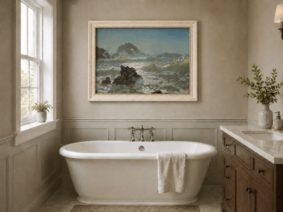 Framed hand-painted seascape oil painting with crashing waves and a rocky sea arch displayed above a freestanding bathtub.
