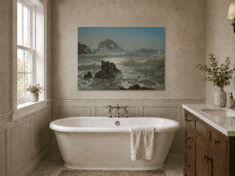 Unframed hand-painted seascape oil painting with crashing waves and a rocky sea arch displayed above a freestanding bathtub.