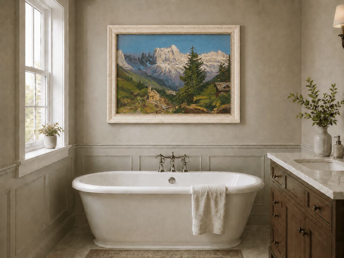 Framed hand-painted Dolomite village oil painting beneath dramatic alpine peaks displayed above a freestanding bathtub.