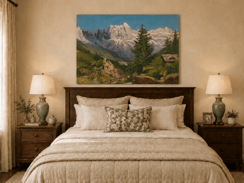Unframed hand-painted Dolomite village oil painting beneath dramatic alpine peaks displayed above a wooden bed in a neutral bedroom.