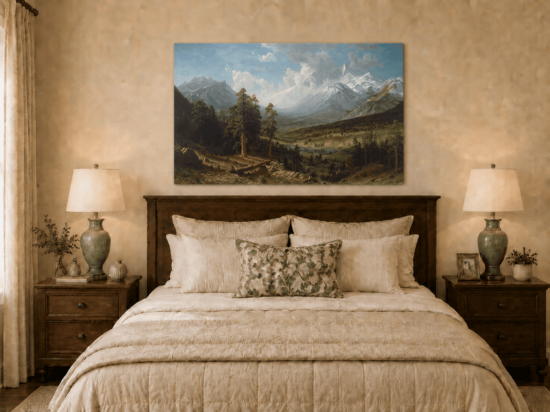Unframed hand-painted Estes Park oil painting with Longs Peak rising above the valley displayed above a wooden bed in a neutral bedroom.