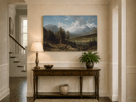 Unframed hand-painted Estes Park oil painting with Longs Peak rising above the valley displayed above an entryway console table.
