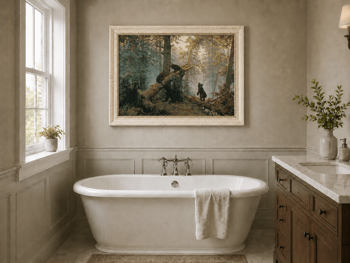 Framed hand-painted forest oil painting with bears beneath sunlit trees displayed above a freestanding bathtub.