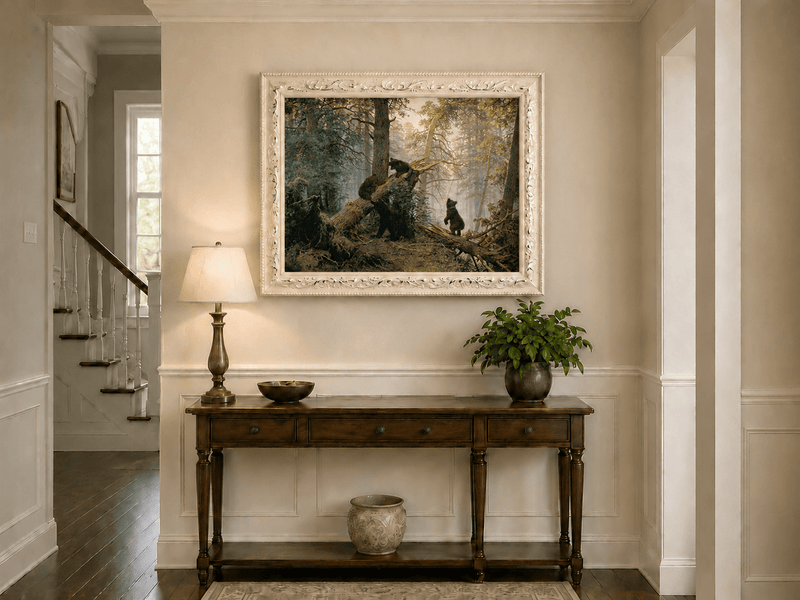 Framed hand-painted forest oil painting with bears beneath sunlit trees displayed above an entryway console table.