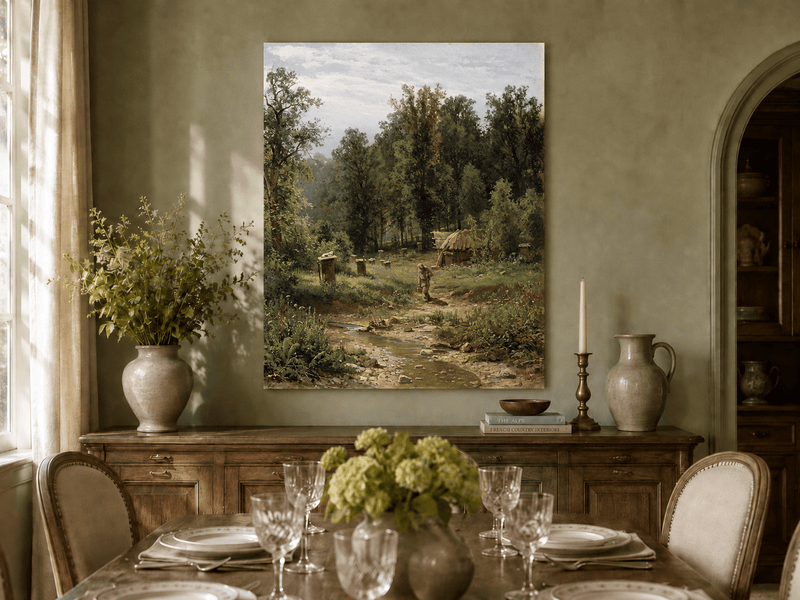 Unframed hand-painted forest cottage oil painting with a stream, path and walking figure displayed above a formal dining table.