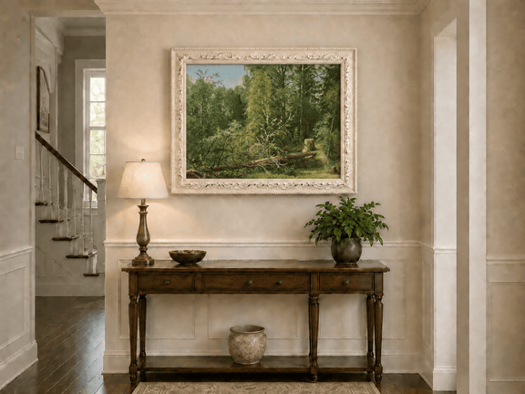 Framed hand-painted woodland oil painting with a fallen tree in a sunlit forest displayed above an entryway console table.