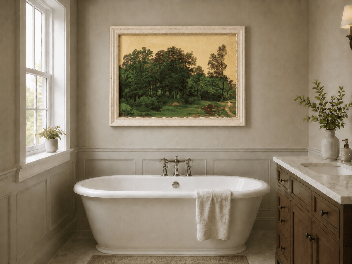 Framed hand-painted forest glade oil painting with a winding stream displayed above a freestanding bathtub.