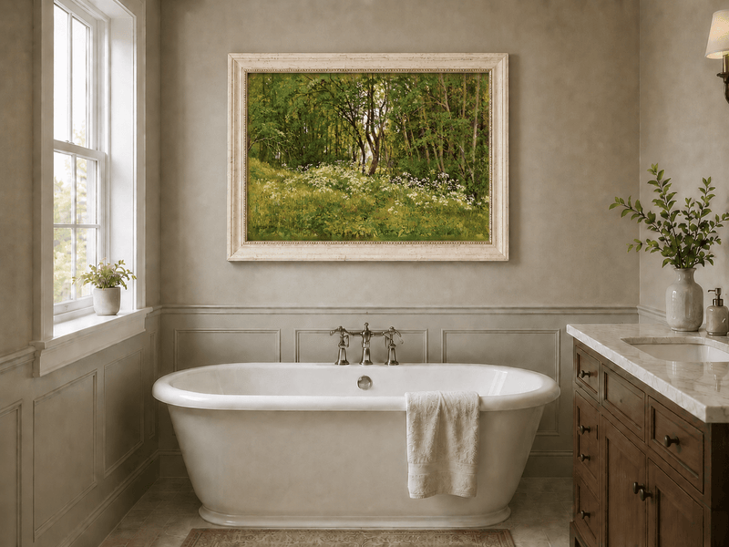 Framed hand-painted forest glade oil painting with wildflowers and tall trees displayed above a freestanding bathtub.