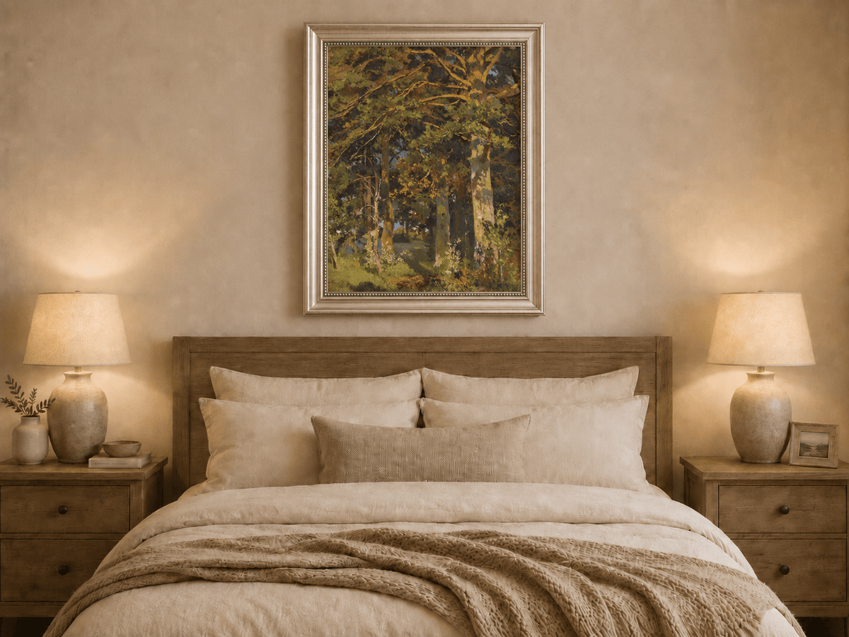 Framed hand-painted forest interior oil painting with sunlit autumn trees and foliage displayed above a wooden bed in a neutral bedroom.