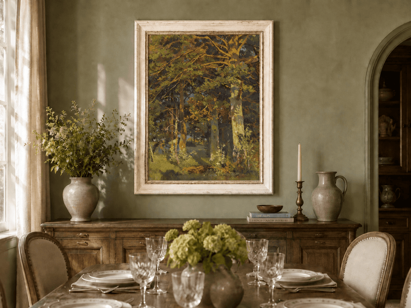 Framed hand-painted forest interior oil painting with sunlit autumn trees and foliage displayed above a formal dining table.