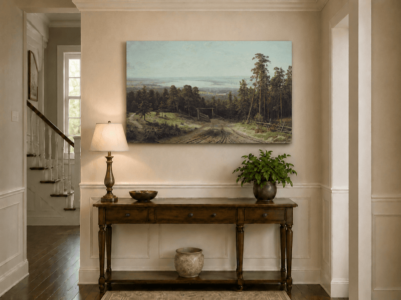 Unframed hand-painted forest path oil painting leading toward a distant lake displayed above an entryway console table.