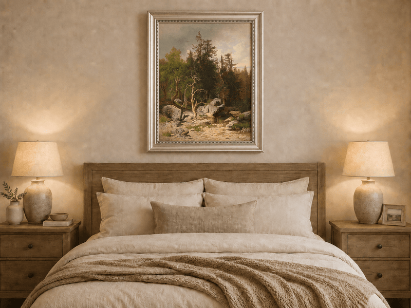 Framed hand-painted forest oil painting with rocks, a creek and a gnarled old tree displayed above a wooden bed in a neutral bedroom.