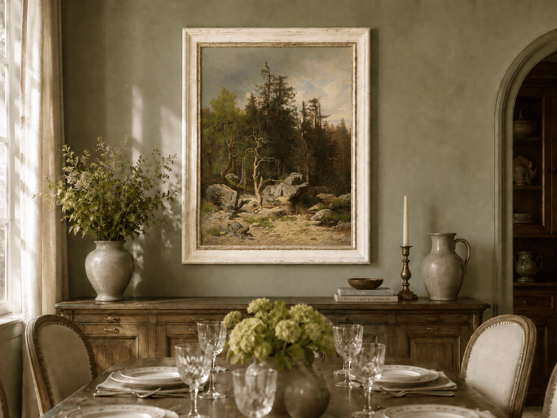 Framed hand-painted forest oil painting with rocks, a creek and a gnarled old tree displayed above a formal dining table.