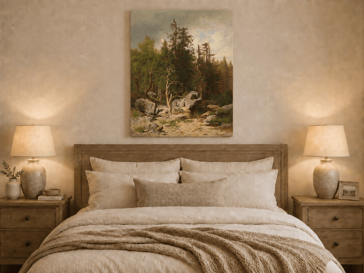 Unframed hand-painted forest oil painting with rocks, a creek and a gnarled old tree displayed above a wooden bed in a neutral bedroom.