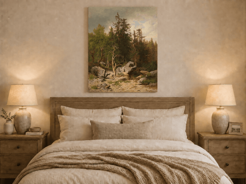 Unframed hand-painted forest oil painting with rocks, a creek and a gnarled old tree displayed above a wooden bed in a neutral bedroom.