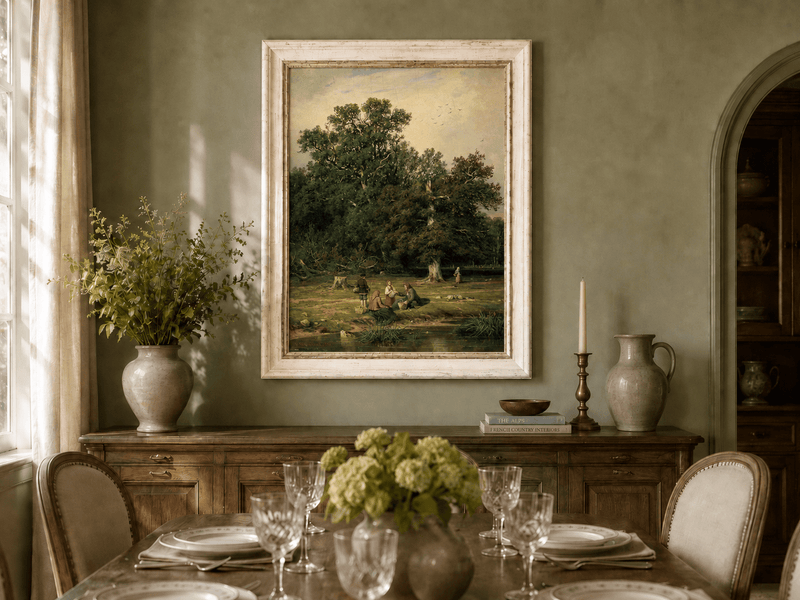 Framed hand-painted forest stream oil painting with figures beneath a large tree displayed above a formal dining table.