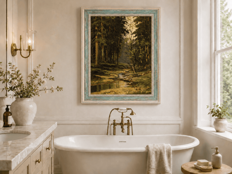 Framed hand-painted forest stream oil painting with tall trees and warm filtered light displayed above a freestanding bathtub.