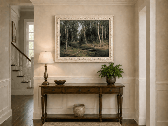 Framed hand-painted forest stream oil painting with figures among the trees displayed above an entryway console table.