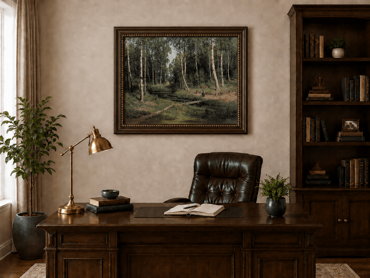 Framed hand-painted forest stream oil painting with figures among the trees displayed above a traditional home office desk.