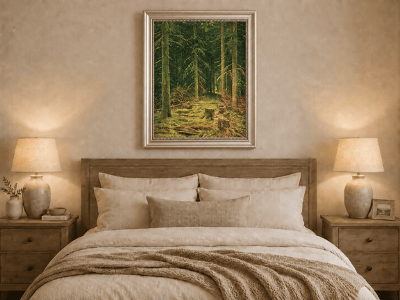 Framed hand-painted evergreen forest oil painting with tree stumps and mossy ground displayed above a wooden bed in a neutral bedroom.