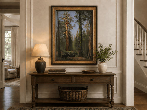 Framed hand-painted giant sequoia forest oil painting with towering trees and sunlight displayed above an entryway console table.
