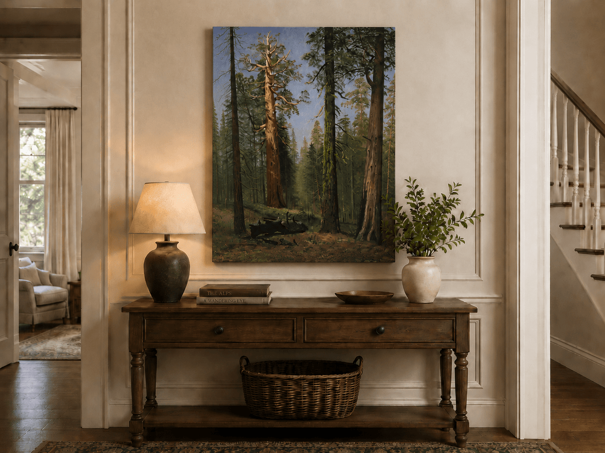 Unframed hand-painted giant sequoia forest oil painting with towering trees and sunlight displayed above an entryway console table.