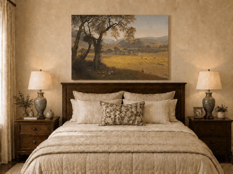 Unframed hand-painted golden meadow oil painting with a picnic scene beneath a broad tree displayed above a wooden bed in a neutral bedroom.