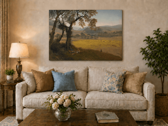 Unframed hand-painted golden meadow oil painting with a picnic scene beneath a broad tree displayed above a neutral living room sofa.