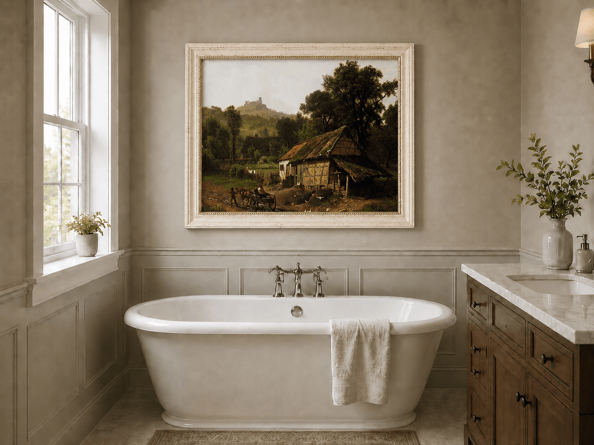 Framed hand-painted rural cottage oil painting with poultry and a distant castle displayed above a freestanding bathtub.