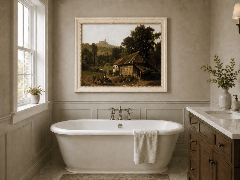 Framed hand-painted rural cottage oil painting with poultry and a distant castle displayed above a freestanding bathtub.