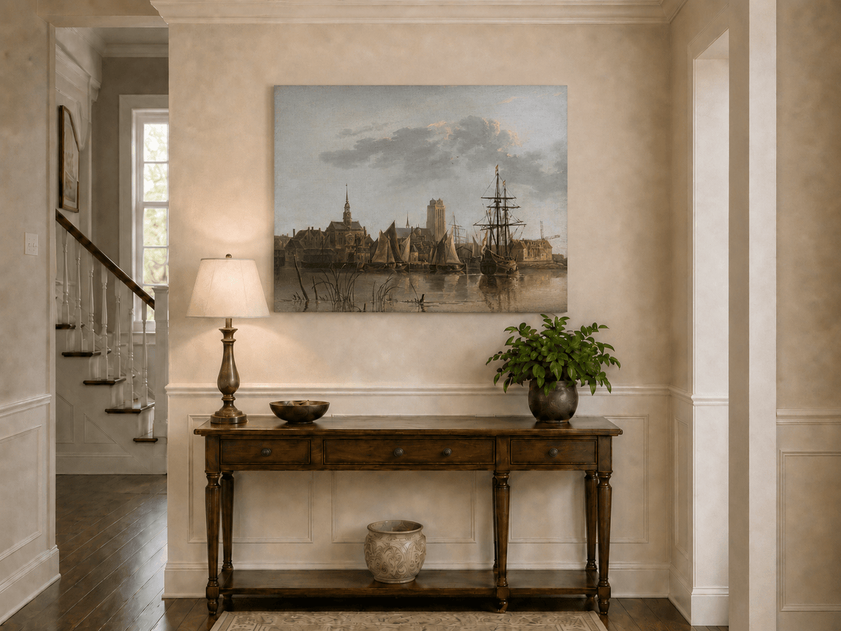 Unframed hand-painted harbor view oil painting with sailing ships beneath a sunset sky displayed above an entryway console table.