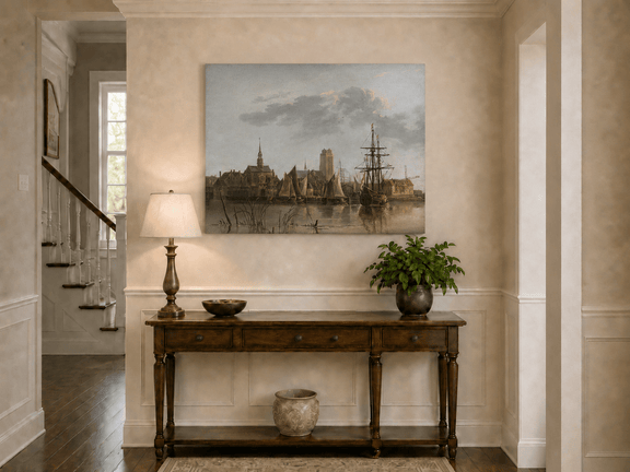 Unframed hand-painted harbor view oil painting with sailing ships beneath a sunset sky displayed above an entryway console table.