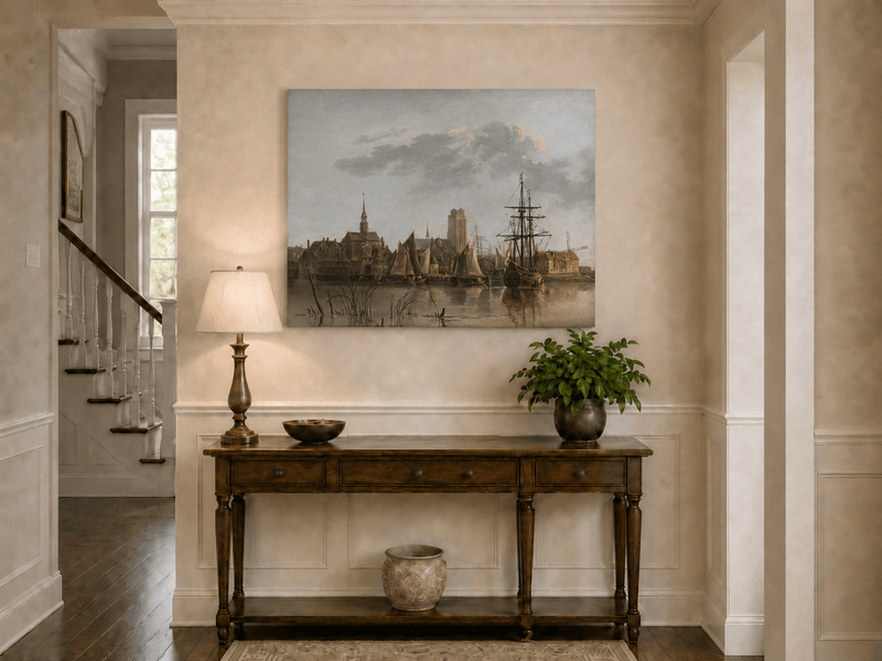 Unframed hand-painted harbor view oil painting with sailing ships beneath a sunset sky displayed above an entryway console table.
