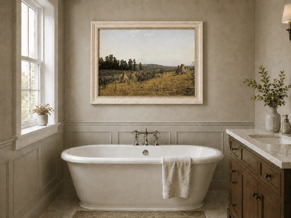 Framed hand-painted harvest field oil painting with haystacks and distant farm workers displayed above a freestanding bathtub.