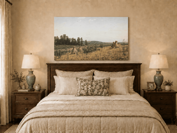 Unframed hand-painted harvest field oil painting with haystacks and distant farm workers displayed above a wooden bed in a neutral bedroom.