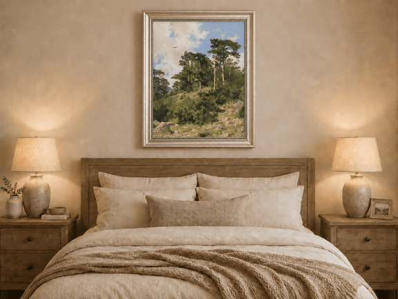 Framed hand-painted hillside oil painting with pine trees, rocks and open sky displayed above a wooden bed in a neutral bedroom.