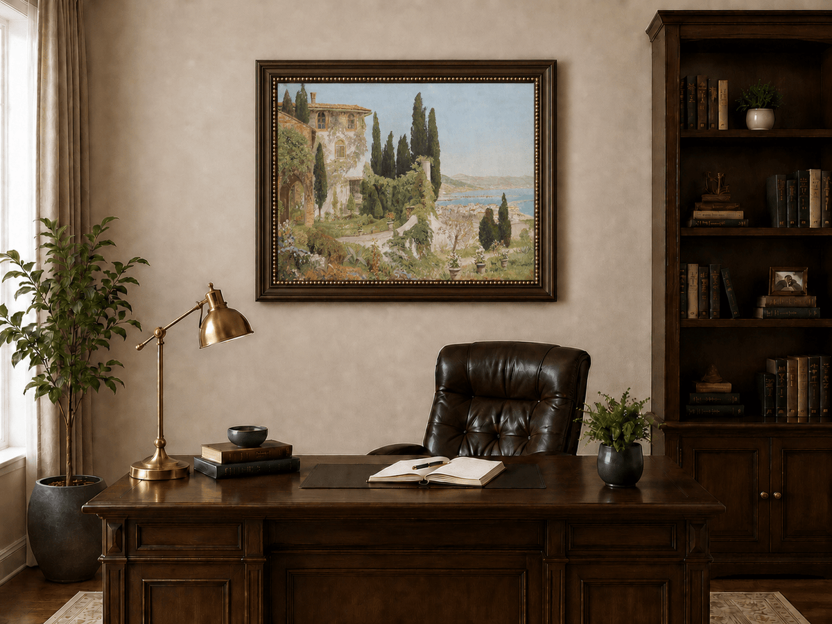 Framed hand-painted Italian garden oil painting with cypress trees overlooking the sea displayed above a traditional home office desk.
