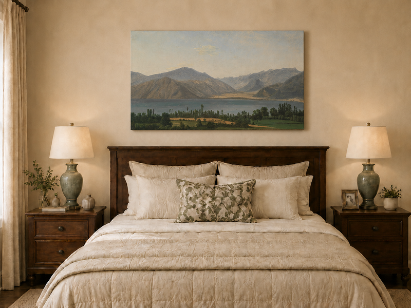 Hand-painted Lake Fucino and Abruzzi Mountains landscape oil painting displayed above a bed in a bedroom interior.