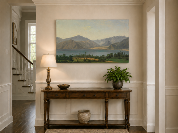 Hand-painted Lake Fucino and Abruzzi Mountains landscape oil painting displayed above a console table in a hallway interior.