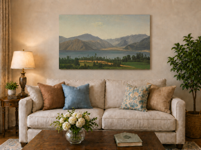 Hand-painted Lake Fucino and Abruzzi Mountains landscape oil painting displayed above a sofa in a living room interior.