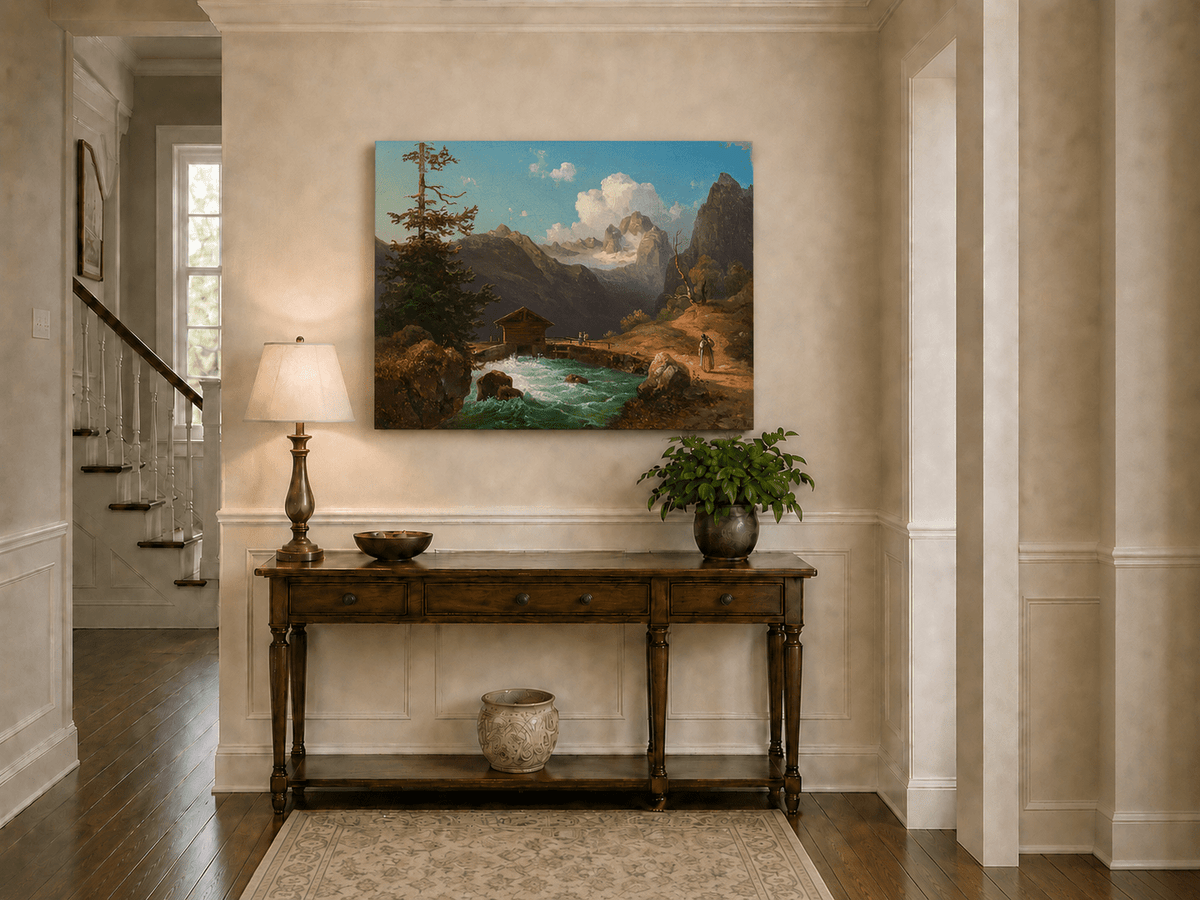 Hand-painted alpine river cabin and mountain valley landscape oil painting displayed above a console table in a hallway interior.