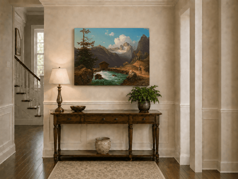 Hand-painted alpine river cabin and mountain valley landscape oil painting displayed above a console table in a hallway interior.