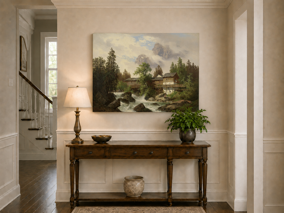 Hand-painted alpine watermill, stream and misty mountain peaks landscape oil painting displayed above a console table in a hallway interior.