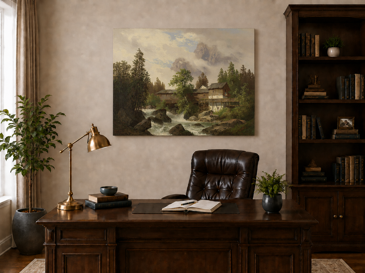Hand-painted alpine watermill, stream and misty mountain peaks landscape oil painting displayed above a desk in a home office interior.
