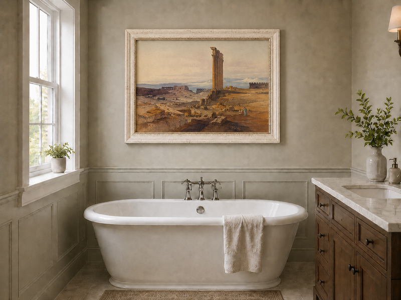 Hand-painted ancient ruins with a column in the desert landscape oil painting displayed in a bathroom interior above a bathtub.