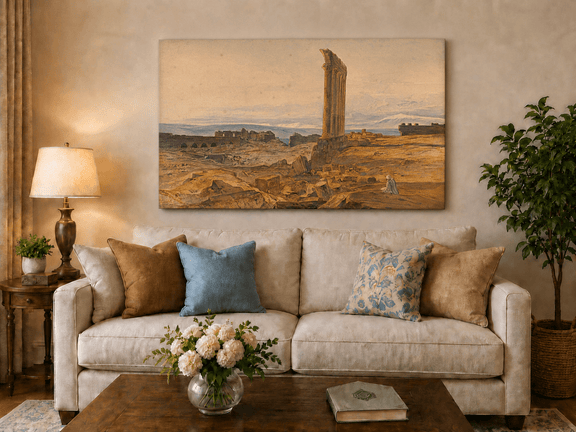 Hand-painted ancient ruins with a column in the desert landscape oil painting displayed above a sofa in a living room interior.