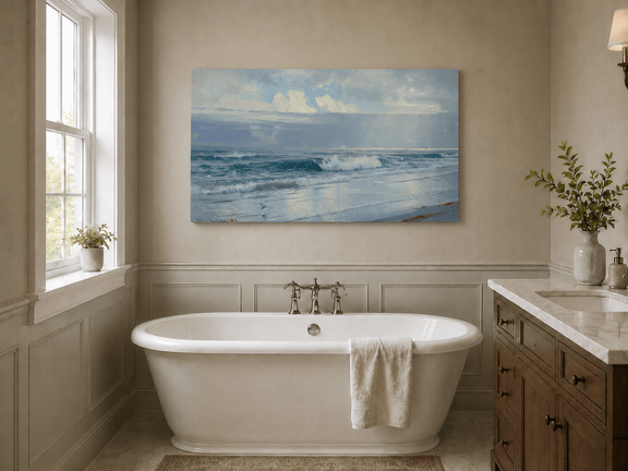 Unframed hand-painted beach oil painting with crashing waves beneath cloudy seaside skies displayed above a freestanding bathtub.