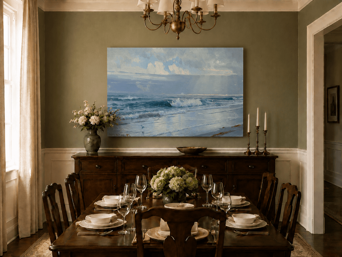 Unframed hand-painted beach oil painting with crashing waves beneath cloudy seaside skies displayed above a formal dining table.